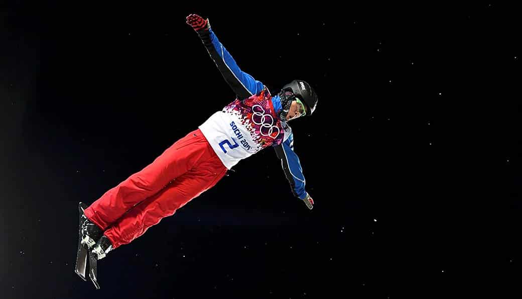 Photograph of skier doing ski jump.