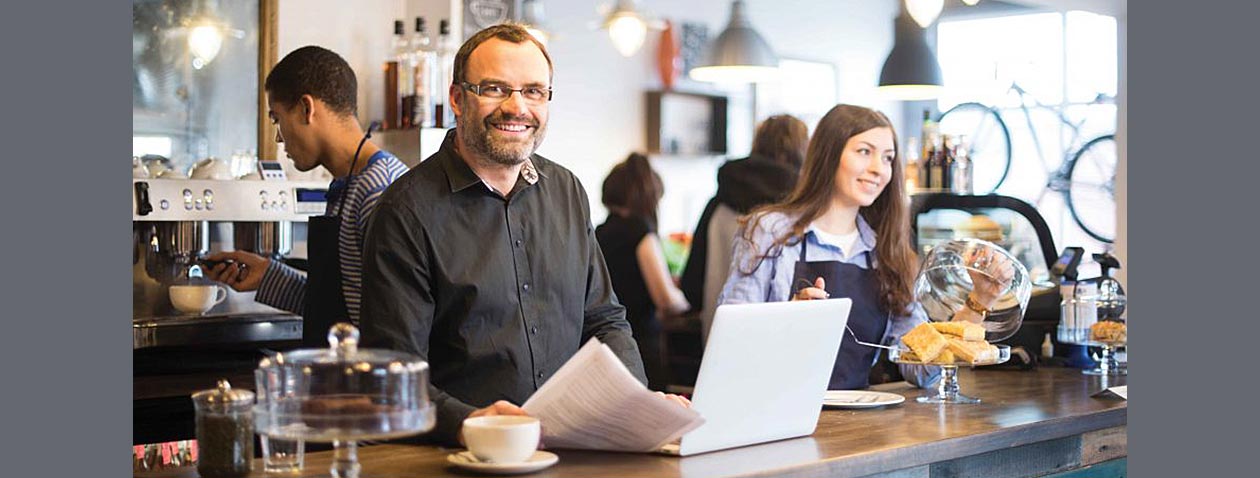 Photo of happy restaurant owner franchisee.